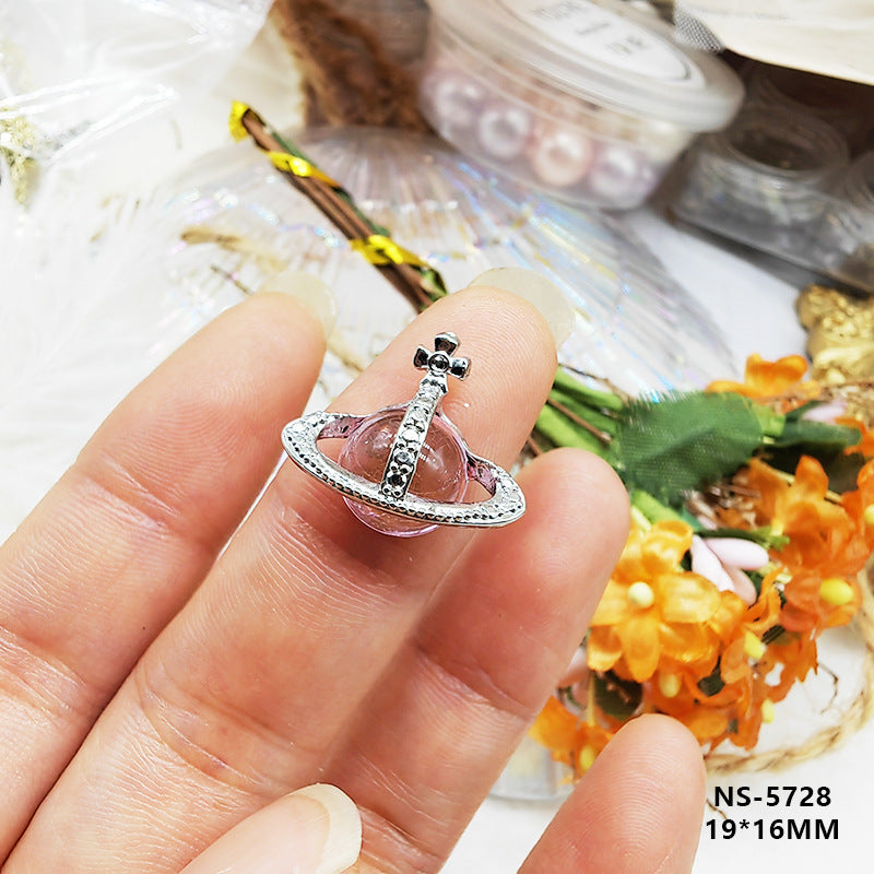 Nail art accessories in dark metallic style with Saturn, pearl, and planet nail stickers for decoration Secondary image